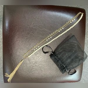 Long pearl and gold statement necklace